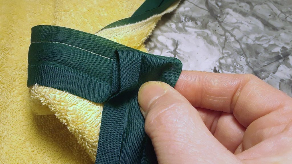 folding bias tape to miter the corner