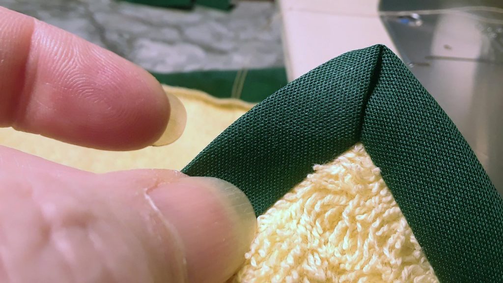 mitered corner of towel binding