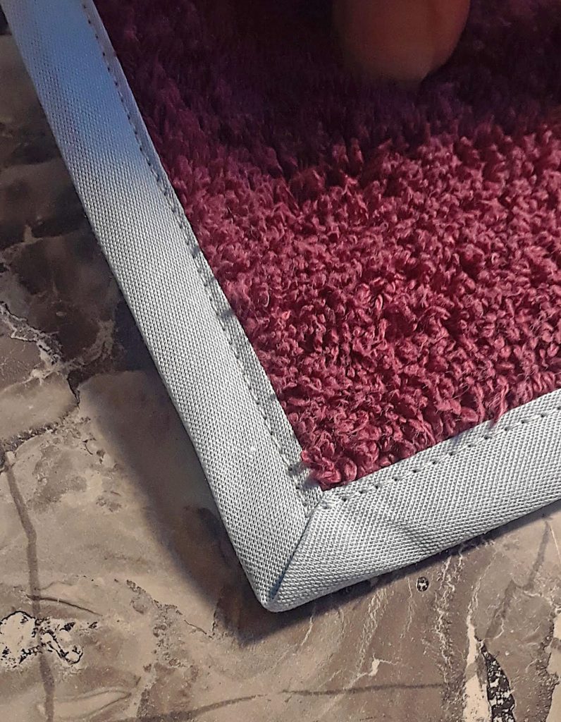 a mitered corner on binding of towel