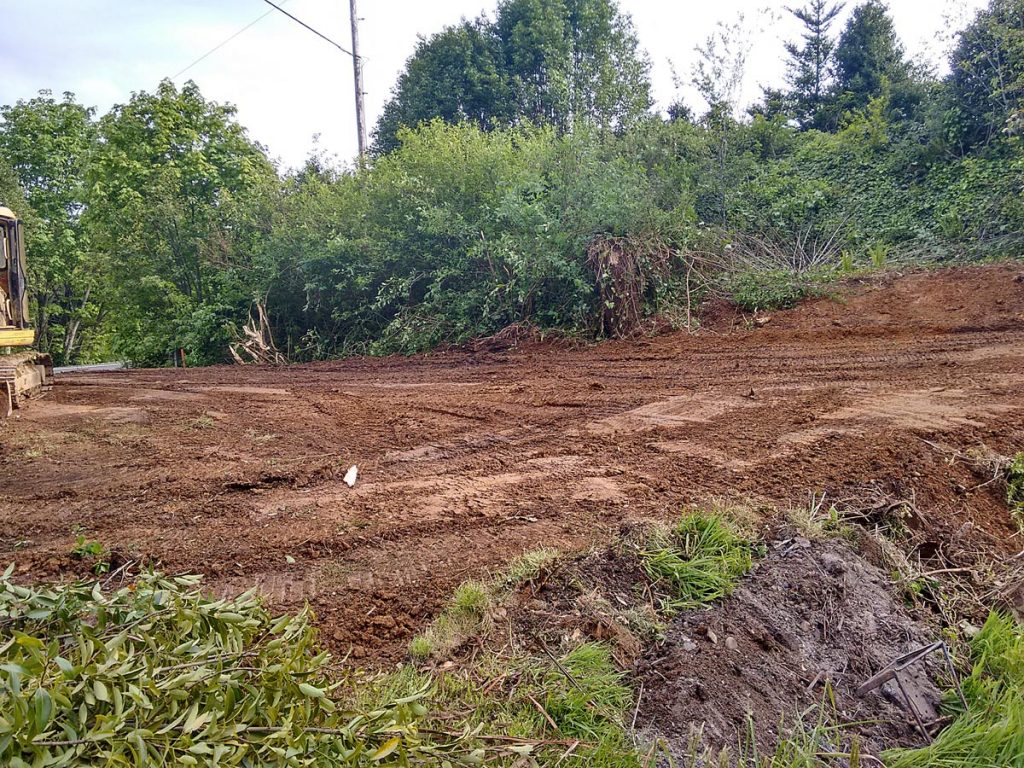 Heavy equipment leveling dirt