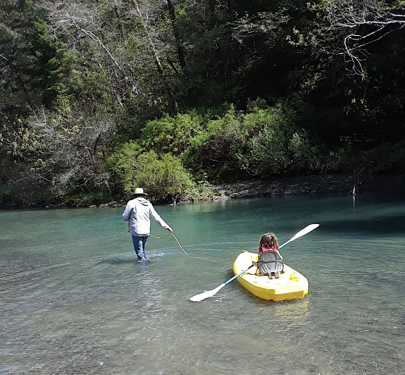 Gramma Lisa towing Tessa in a kayak