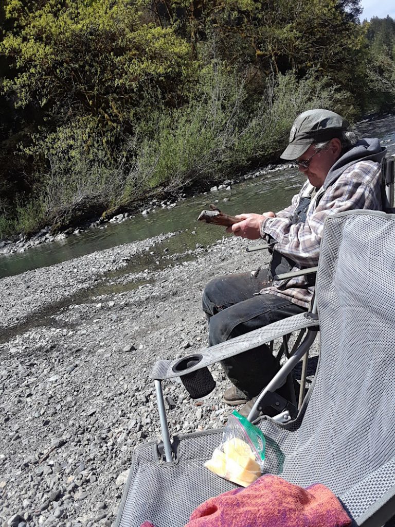 Grampa Gary whittling a stick